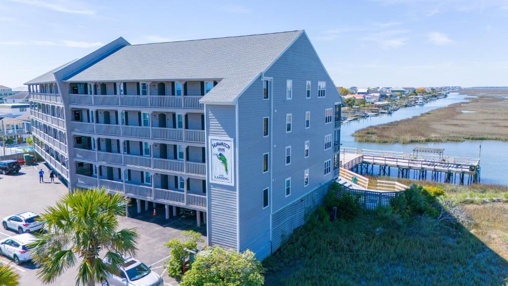 an aerial view of a building next to a marina at Sea Watch Inn at the Landing in Myrtle Beach