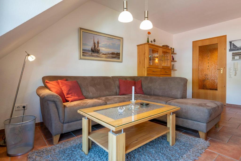 a living room with a couch and a coffee table at Ferienpark Freesenbruch Wohnung 4 5 - Kranichtanz in Zingst