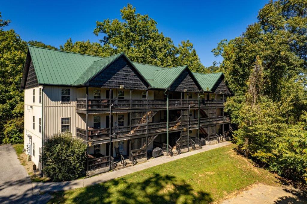 an aerial view of a large house with a green roof at Briarstone Lodge Condo 13C in Pigeon Forge