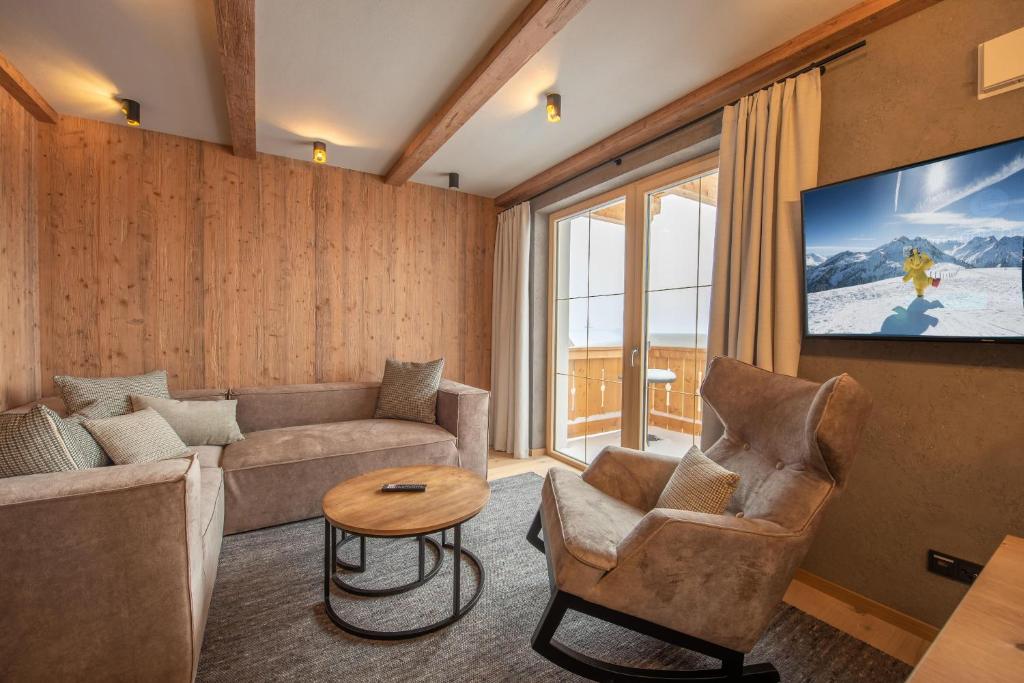 TV a/nebo společenská místnost v ubytování Filzsteinresort Wohnungen Top 7