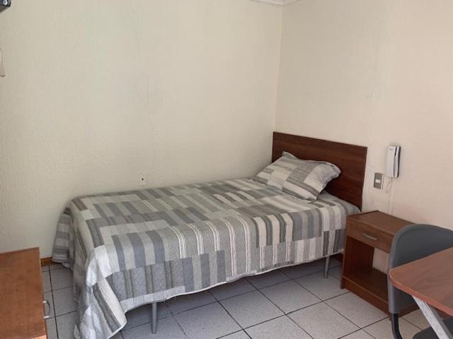 Postel nebo postele na pokoji v ubytování Homerent