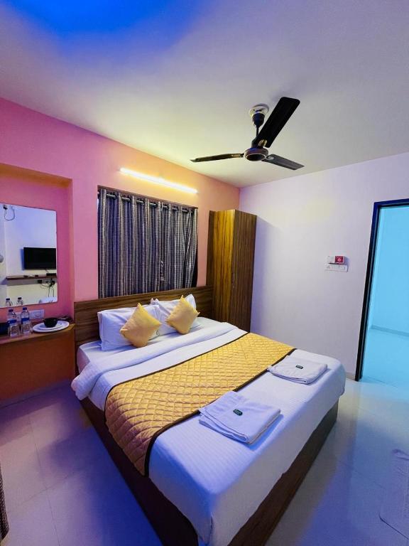 Postel nebo postele na pokoji v ubytování Habitat Inn