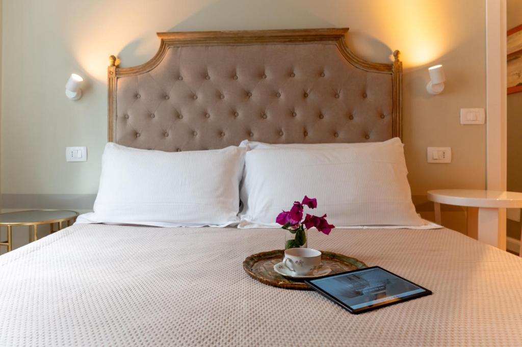 Postel nebo postele na pokoji v ubytování Gian Paul Hotel