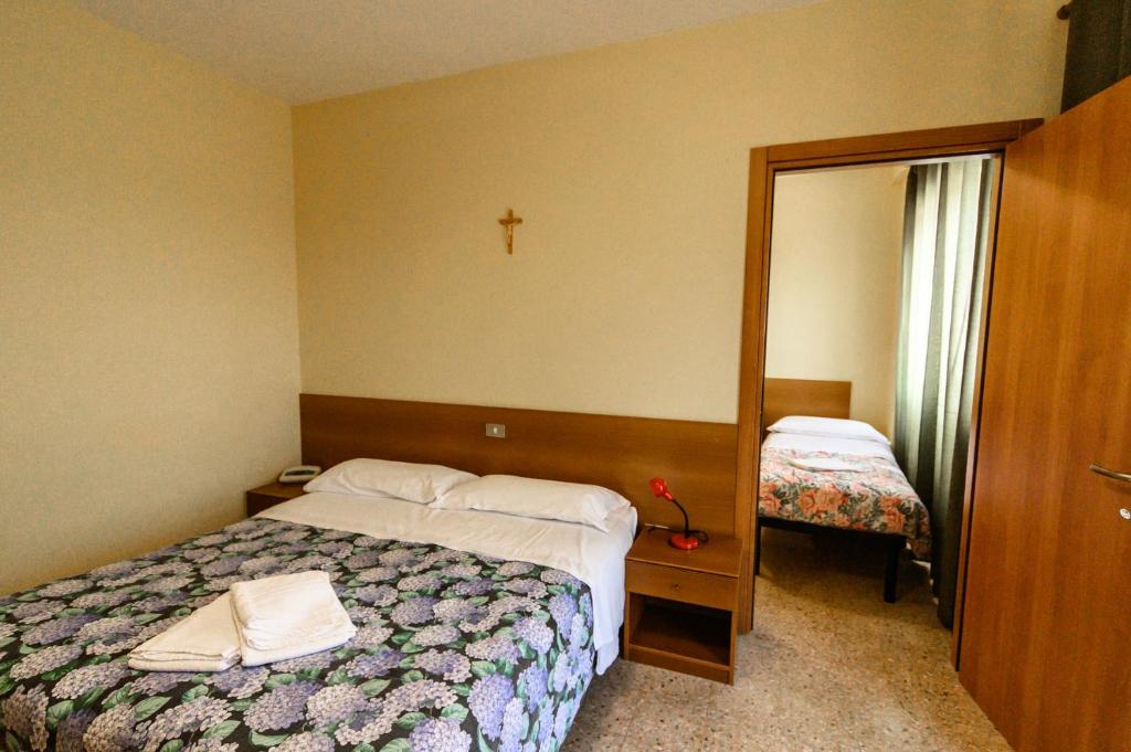 Postel nebo postele na pokoji v ubytování Fortezza