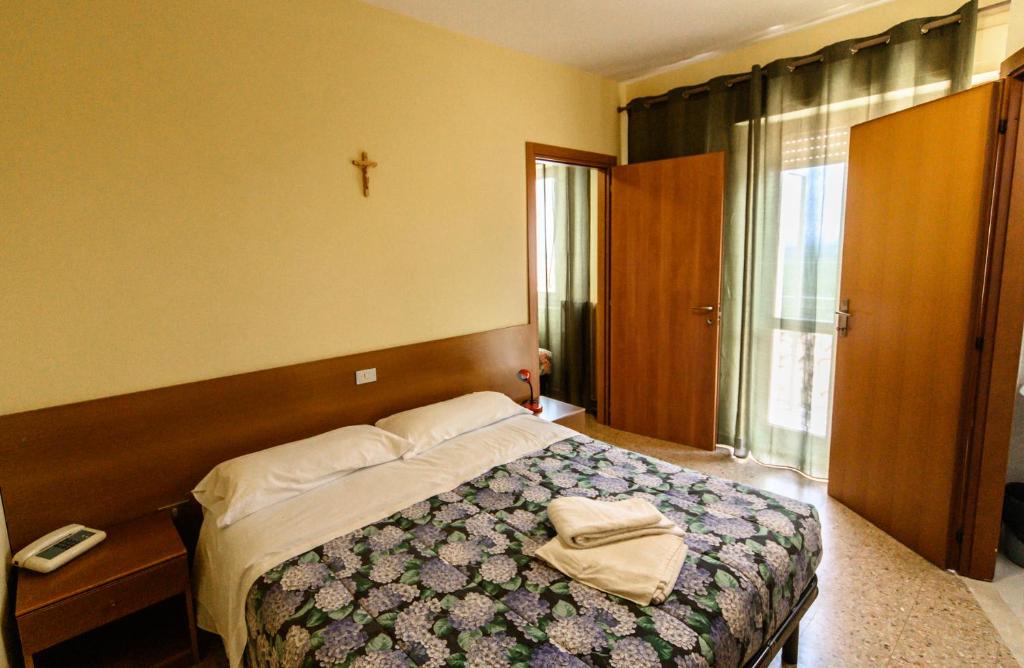 Postel nebo postele na pokoji v ubytování Fortezza