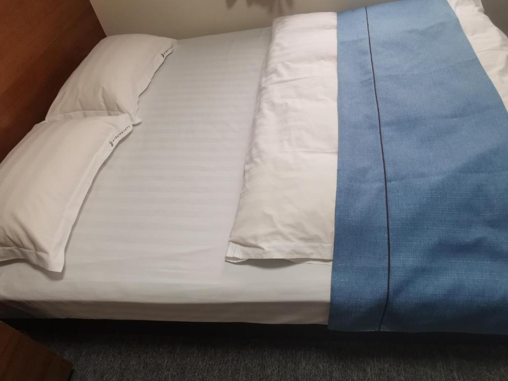 Postel nebo postele na pokoji v ubytování Business Hotel Azuma