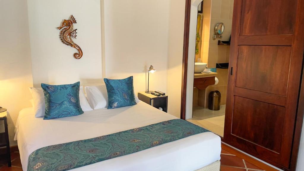 Postel nebo postele na pokoji v ubytování Hotel Galapagos Suites B&B