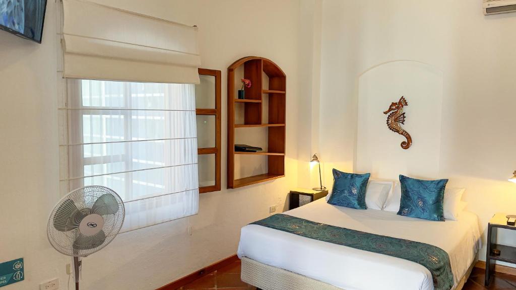Postel nebo postele na pokoji v ubytování Hotel Galapagos Suites B&B