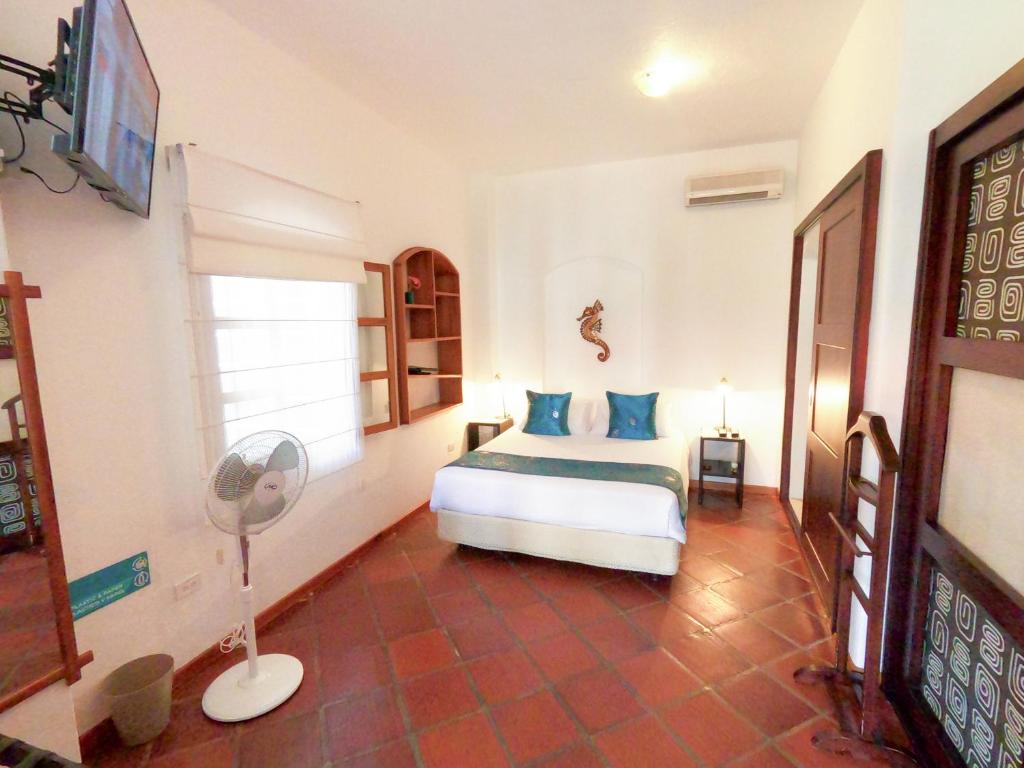 Postel nebo postele na pokoji v ubytování Hotel Galapagos Suites B&B