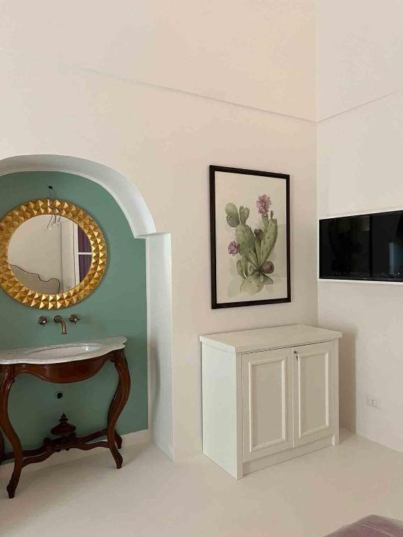 TV a/nebo společenská místnost v ubytování Il Palazzetto Ponza