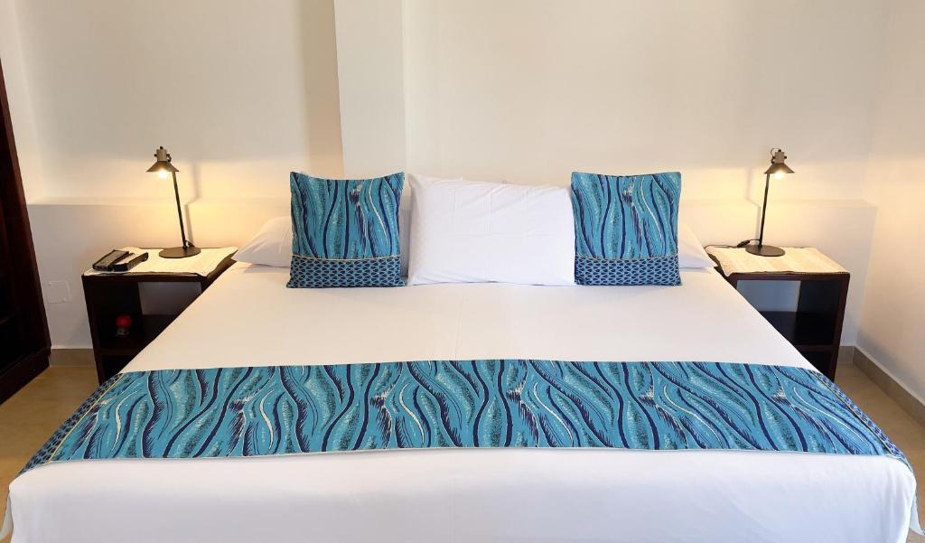 Postel nebo postele na pokoji v ubytování Hotel Galapagos Suites B&B