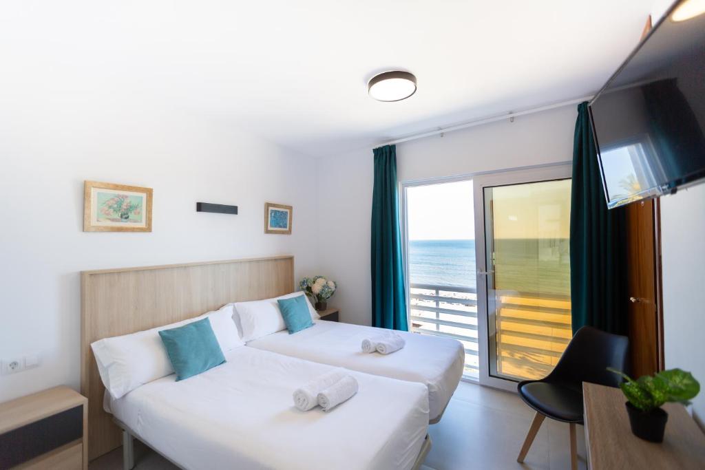 Postel nebo postele na pokoji v ubytování Hotel Mediterráneo by Croma