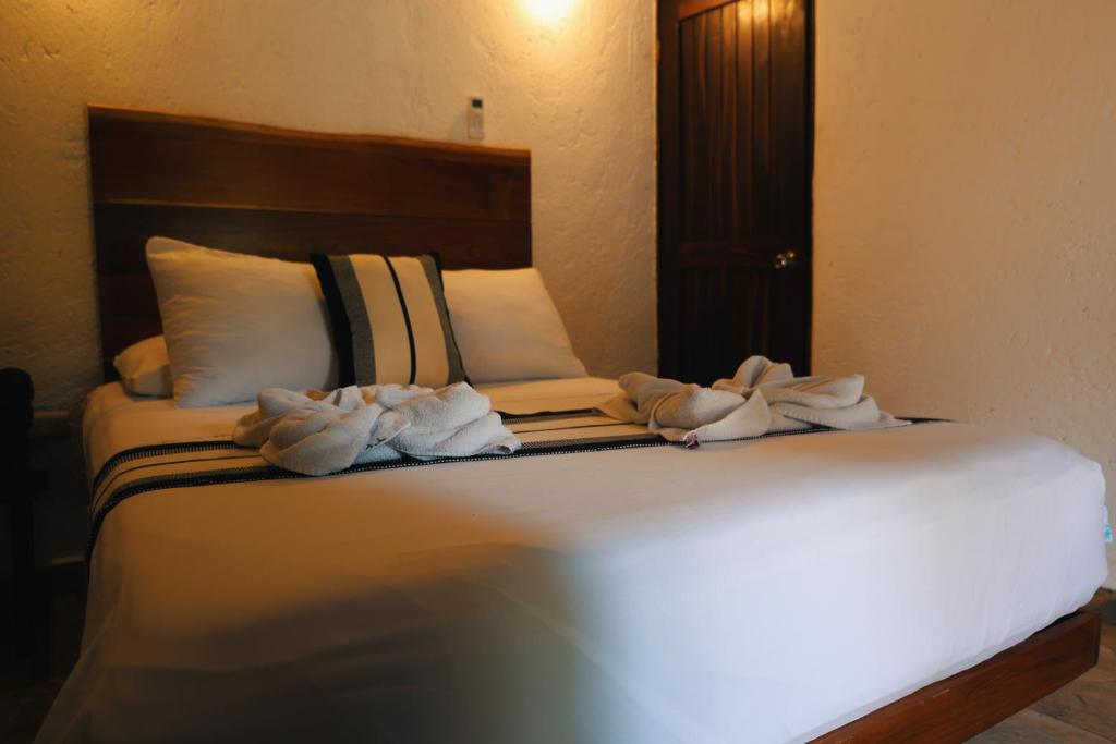 Postel nebo postele na pokoji v ubytování Villas Tucan Bacalar Lagoon Front