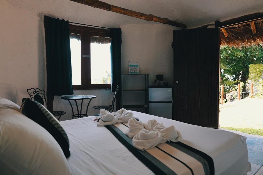 Postel nebo postele na pokoji v ubytování Villas Tucan Bacalar Lagoon Front