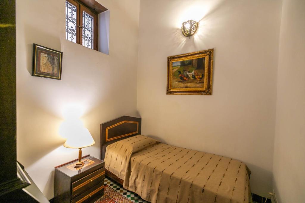 Postel nebo postele na pokoji v ubytování Ryad Mabrouka