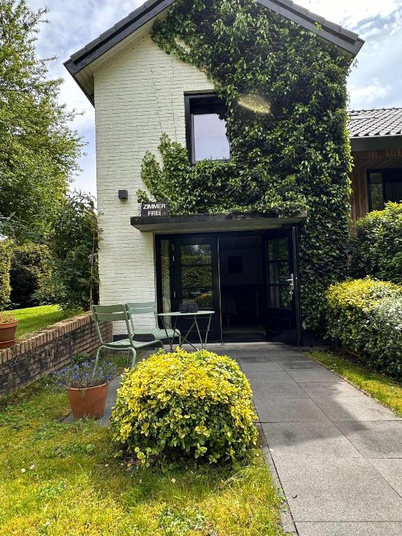 a house with a bench in front of it at La Grange 28 in Bergen op Zoom