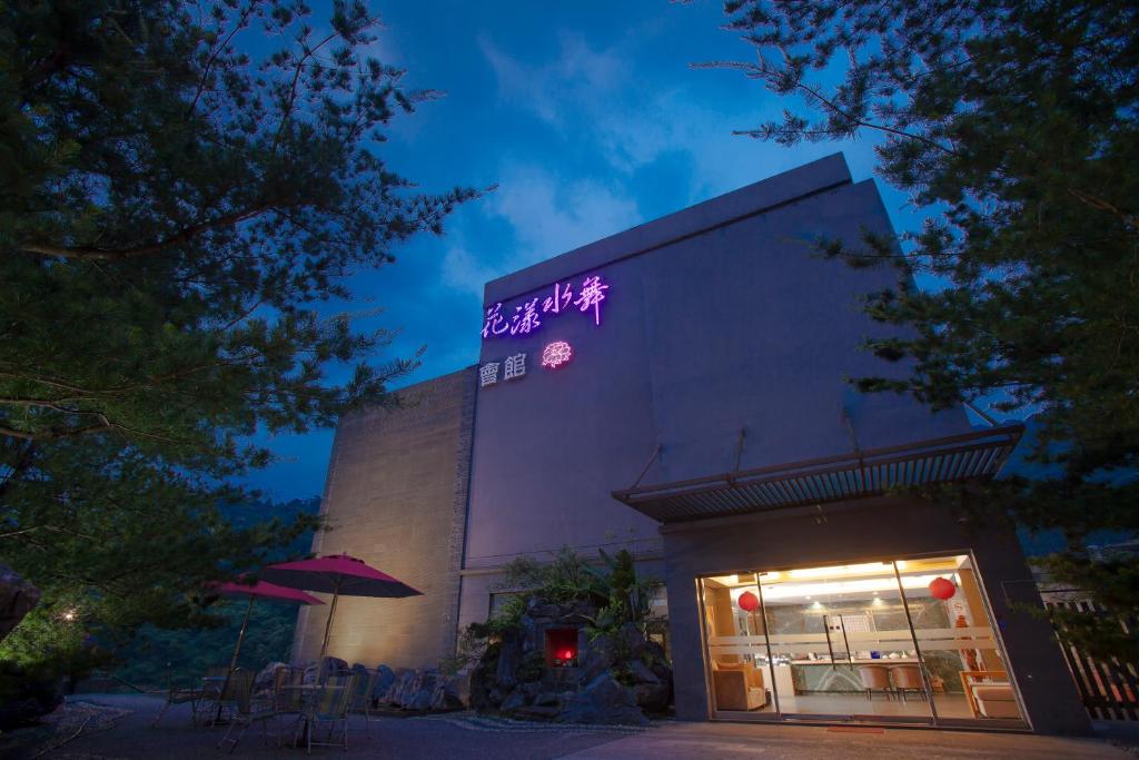 a building with a sign on the side of it at Boutique Hot Spring Resort in Xindian