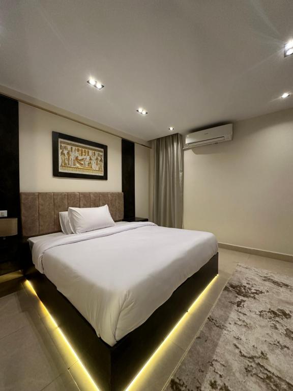 Voodi või voodid majutusasutuse Crowne Pyramids View inn toas
