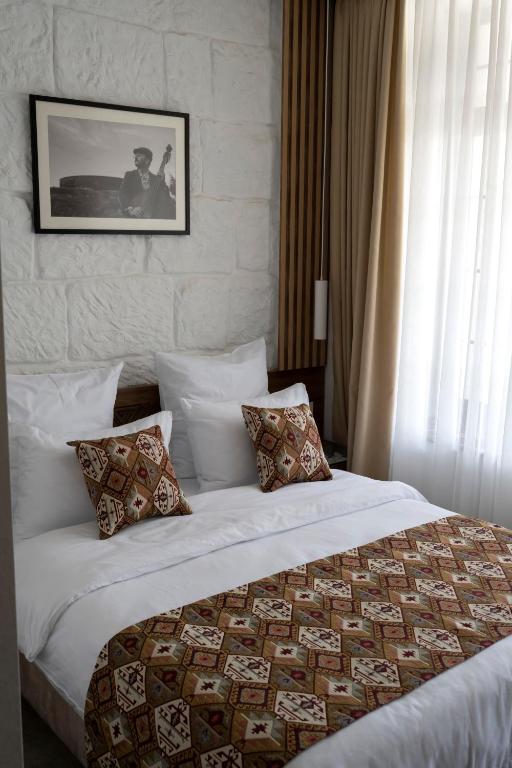 Postel nebo postele na pokoji v ubytování JAZZ HOTEL Gyumri