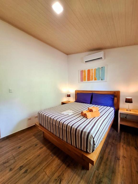 Postel nebo postele na pokoji v ubytování Alloro Jungle Villas