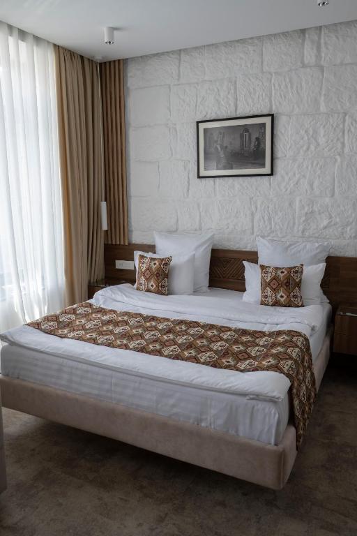 Postel nebo postele na pokoji v ubytování JAZZ HOTEL Gyumri