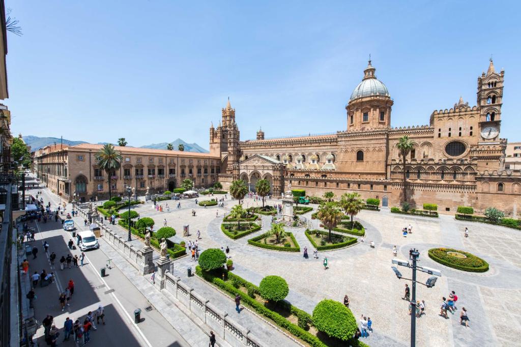 a large building with a plaza in front of it at Cathedral View Apartments in Palermo