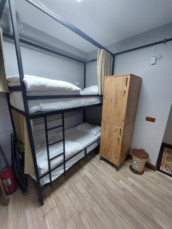 Postel nebo postele na pokoji v ubytování Moon Hostel