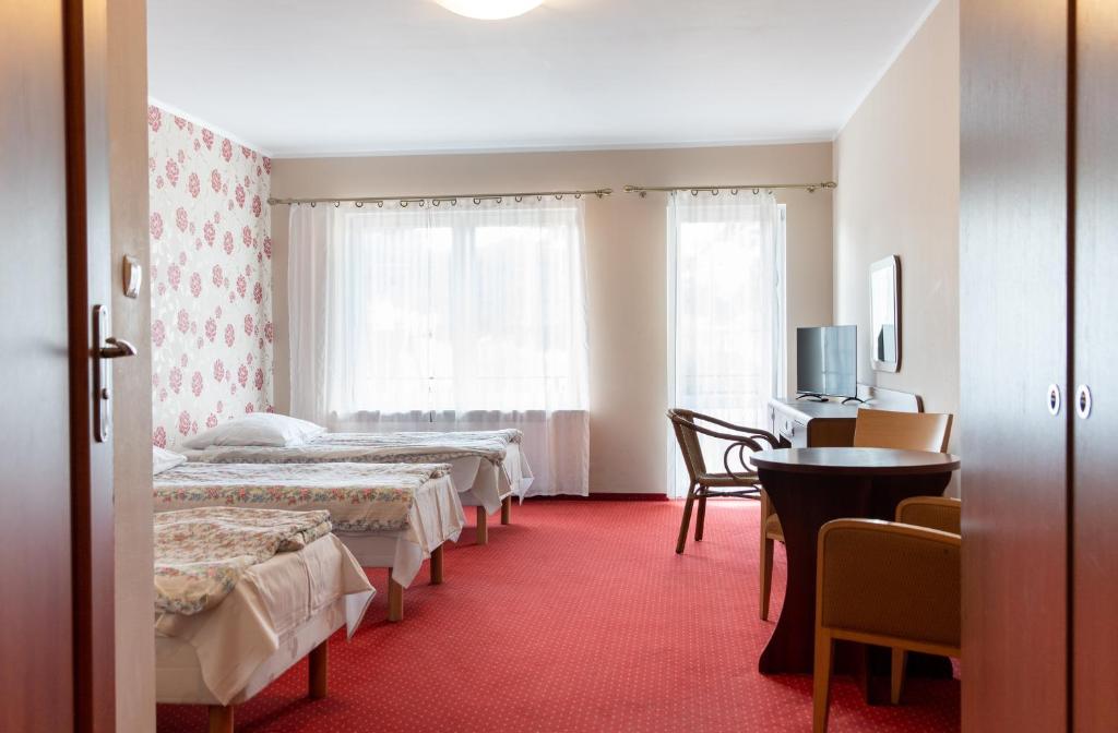 Postel nebo postele na pokoji v ubytování Ośrodek Wczasowy Marevita