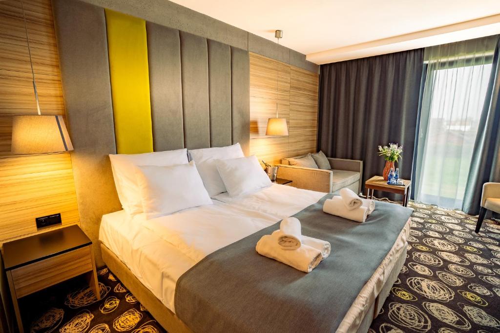 Postel nebo postele na pokoji v ubytování Mielenko & Spa ex Baltin Hotel