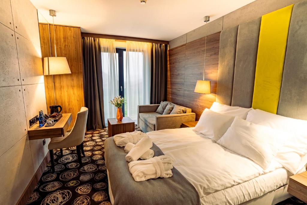 Postel nebo postele na pokoji v ubytování Mielenko & Spa ex Baltin Hotel