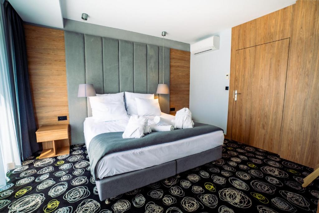 Postel nebo postele na pokoji v ubytování Mielenko & Spa ex Baltin Hotel