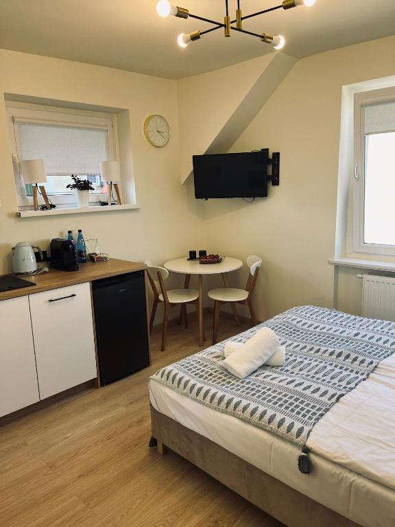 Posteľ alebo postele v izbe v ubytovaní Karwia Pokoje & Apartamenty