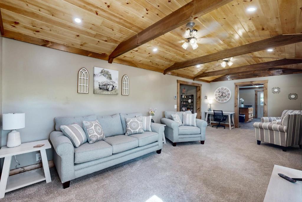 a living room with a couch and two chairs at Morganton Escape in Morganton