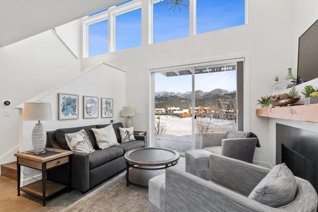 a living room with a couch and a fireplace at Quarry B3 in Whitefish