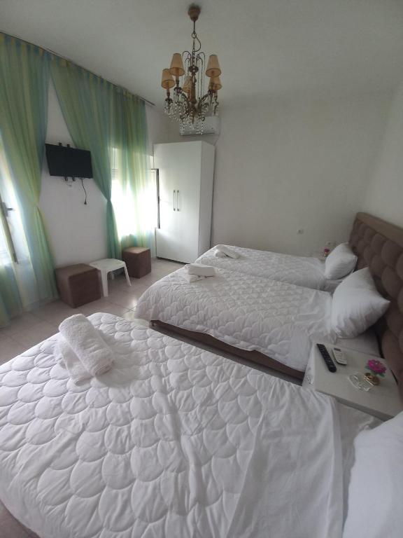 Postel nebo postele na pokoji v ubytování Aleko Guest House