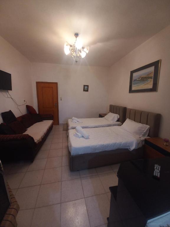 Postel nebo postele na pokoji v ubytování Aleko Guest House