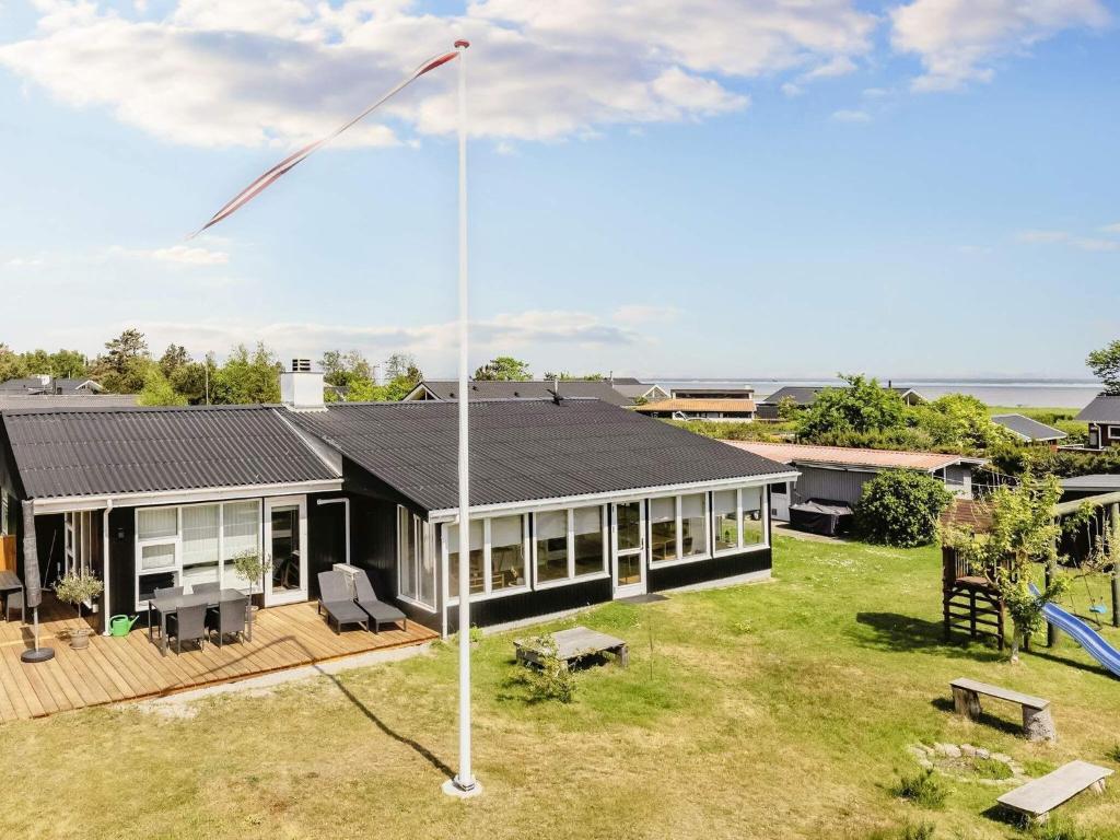 a house with a kite on the roof at 4 star holiday home in Hadsund-By Traum in Hadsund