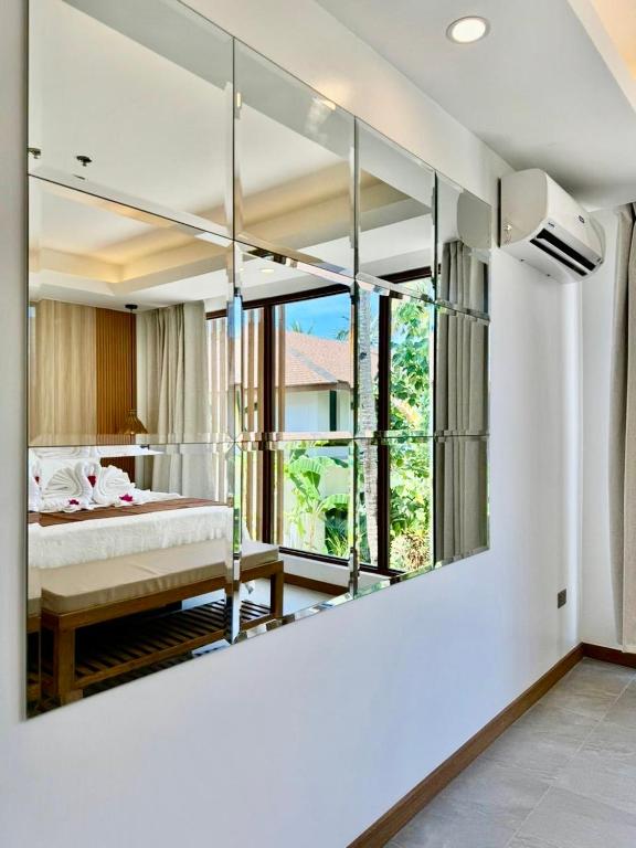 Postel nebo postele na pokoji v ubytování Siargao Island Villas