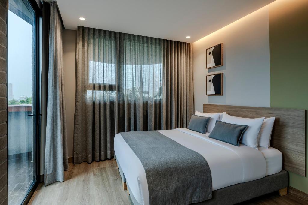 Postel nebo postele na pokoji v ubytování Heiss Hotel