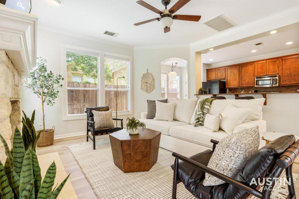 a living room with a couch and a table at Perfect Central Location w Free Prkg and Cozy Beds in Austin