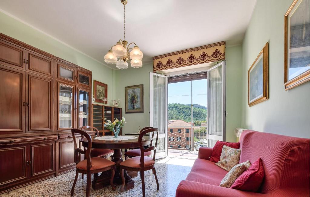 a living room with a table and a couch at Gorgeous Apartment In Sestri Levante in Sestri Levante