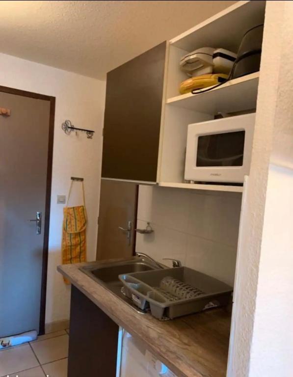 Kuchyň nebo kuchyňský kout v ubytování super cosy Métabief pied piste