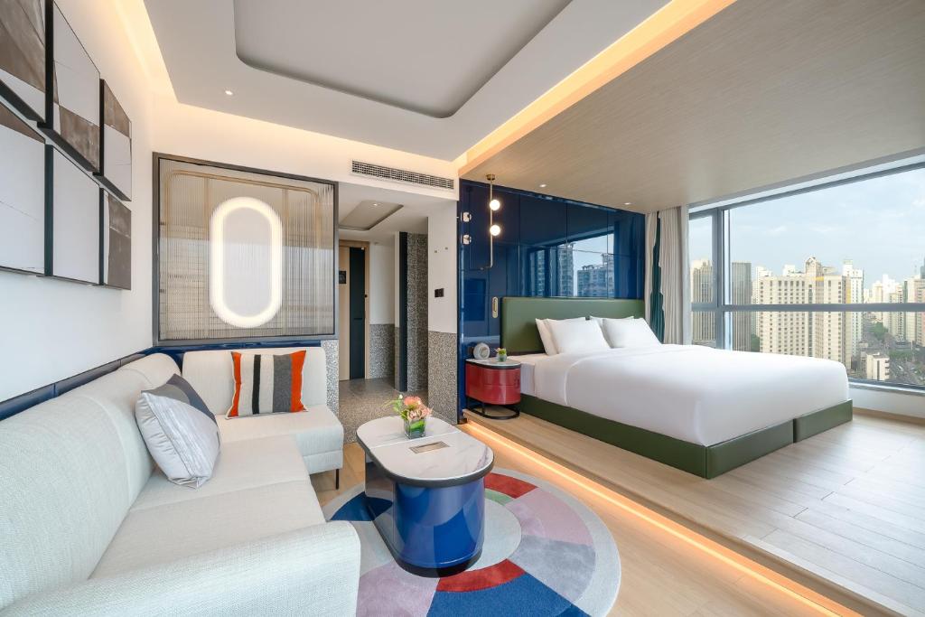 Ένα ή περισσότερα κρεβάτια σε δωμάτιο στο Atour Mansion Shanghai City Center