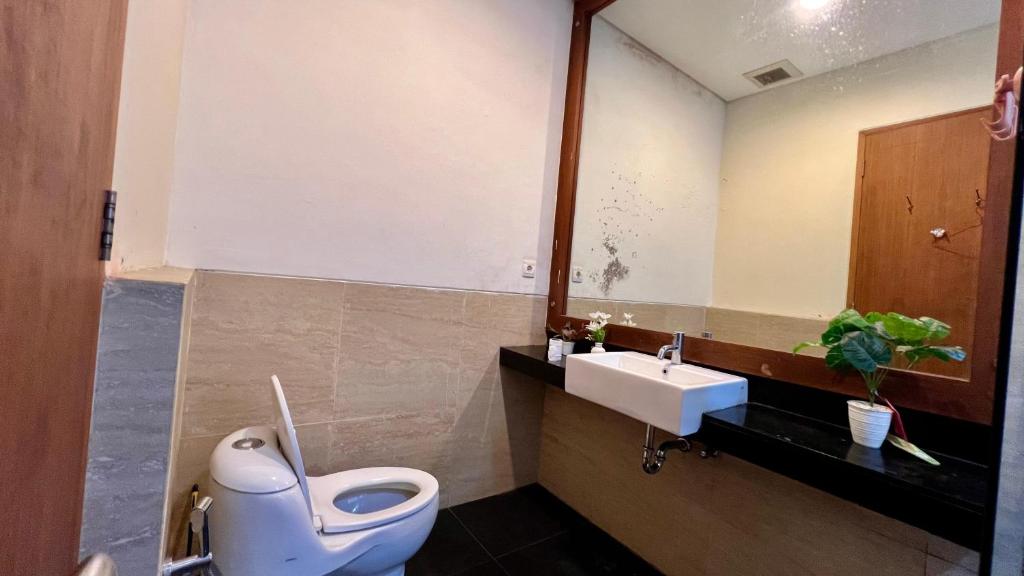 Koupelna v ubytování Vimala Hills Villa & Resort Megamendung Puncak