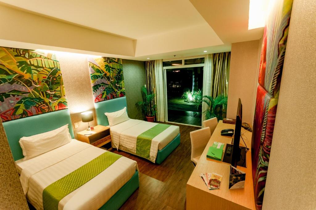 Postel nebo postele na pokoji v ubytování Aziza Paradise Hotel