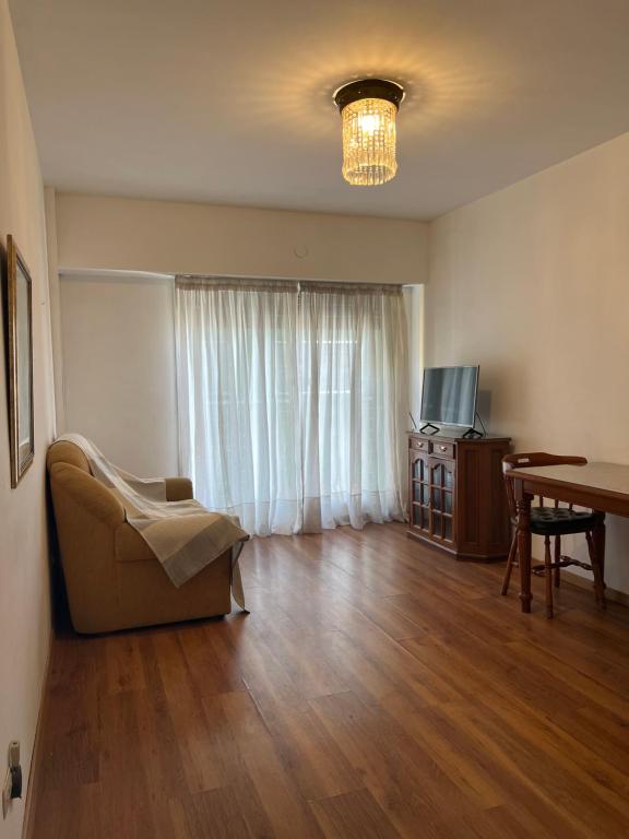 a living room with a couch and a table at Depto 51 in La Plata