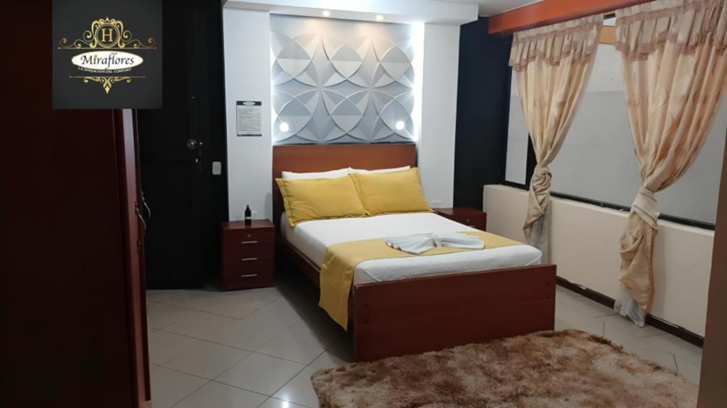 Postel nebo postele na pokoji v ubytování Hotel Miraflores