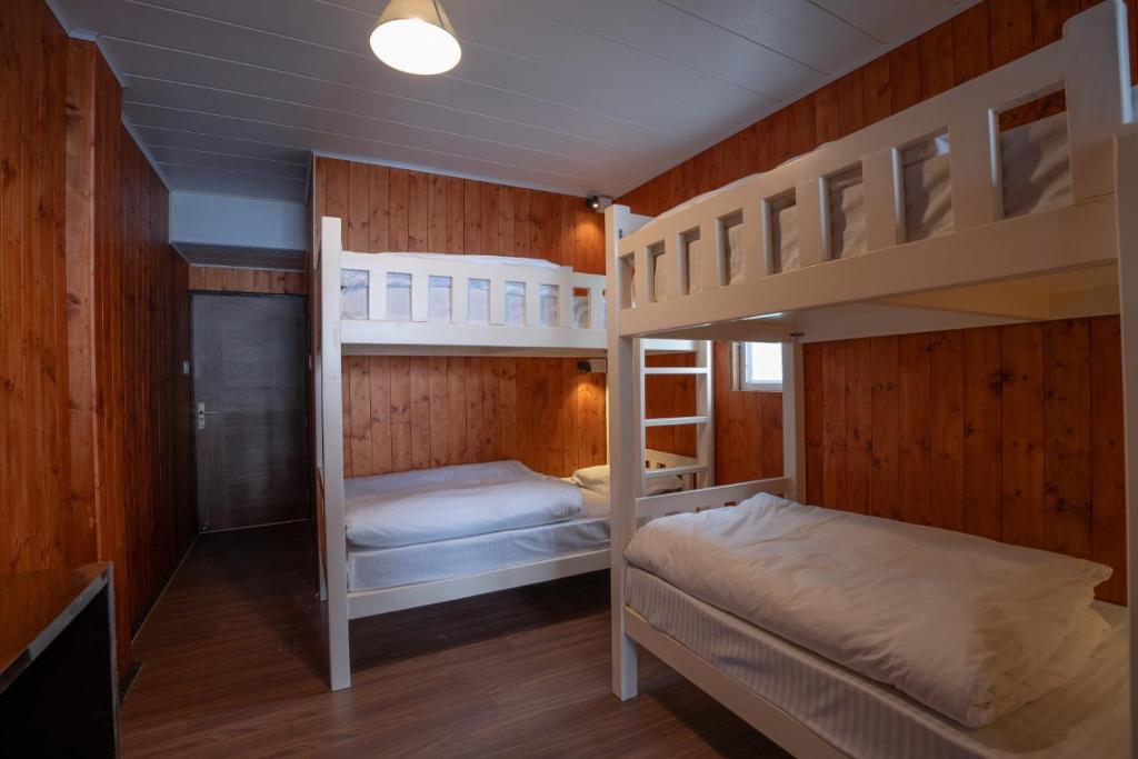 Postel nebo postele na pokoji v ubytování Poshtel, Meghma , Sandakphu
