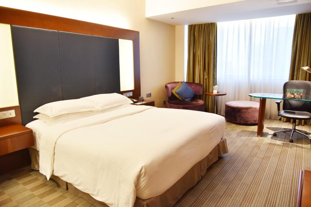 Postel nebo postele na pokoji v ubytování Holiday Inn Shanghai Pudong by IHG