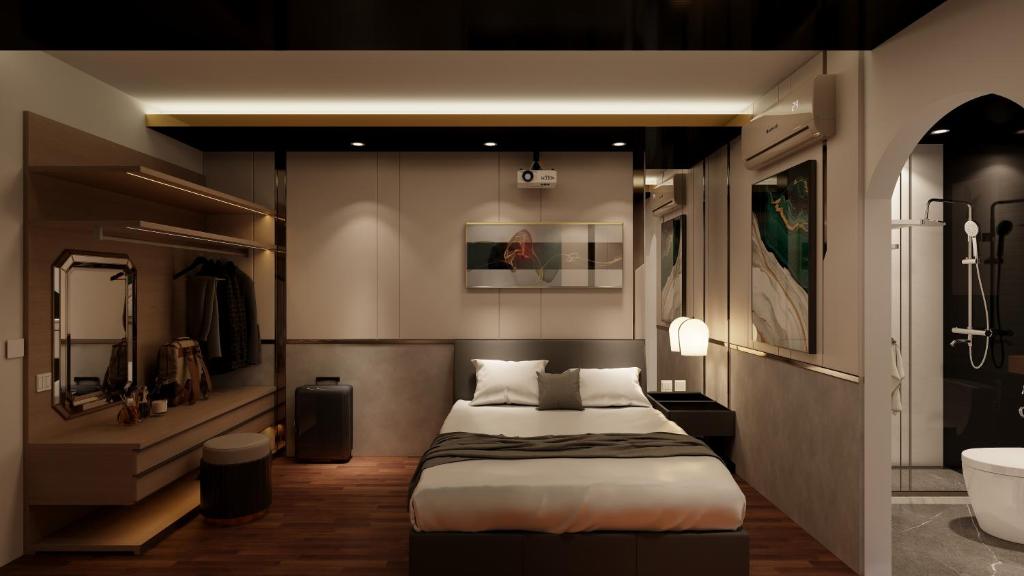 ein Schlafzimmer mit einem Bett und ein Badezimmer mit einem Waschbecken in der Unterkunft M&H Hotel in Ho-Chi-Minh-Stadt